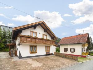 a white house with a brown roof at Apartment in Tröpolach near Nassfeld in Tröpolach +31 photos
