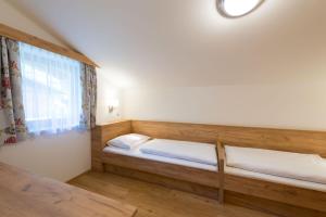 A bed or beds in a room at Landhaus Huber