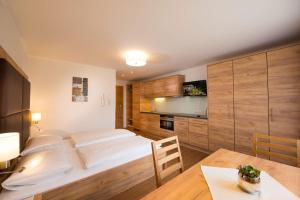 A bed or beds in a room at Landhaus Huber