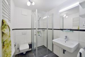 Koupelna v ubytování Ferienwohnung Strandkörbchen + 5 fotografií