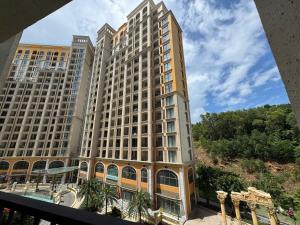 a large apartment building with a view of it at Hillside residence Phu Quoc, sea &firework view in Phu Quoc