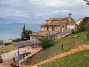 a house on the side of a hill at Villa in Cortona with Private Pool in Magione +33 photos