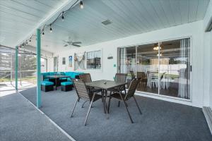 a patio with a table and chairs on it at GRH14403 - Charlotte Harbor Area - 2 Bed 2 Baths Villa in Murdock