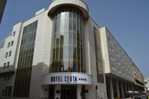 a building with a sign on the front of it at Hotel Ceuta Puerta de Africa in Ceuta