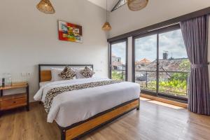 En eller flere senge i et værelse på Nice Villa Berawa