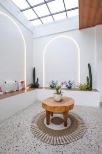a table with a potted plant on top of a room at 3 Bedrooms Private Villa & Pool Near GWK-ER House in Jimbaran