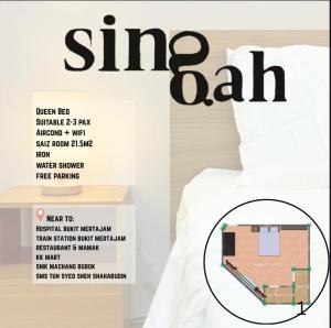a bed with a sign that reads sing bat at Singah in Bukit Mertajam