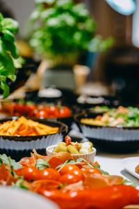 a table filled with different types of food at Willa Marianna in Lądek-Zdrój