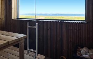 a room with a window and a table and a windowpectpect at 4 Bedroom Amazing Home In Fredericia in Fredericia +10 photos
