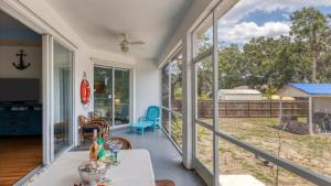 a screened in porch with a view of a yard at GRH14269 - Sarasota County - 3 Bed 2 Baths Villa in Laurel