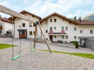 a playground in front of a house at Apartment in Strengen near Ski Slopes in Strengen +31 photos