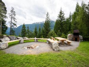 a park with a picnic table and a fire place at Apartment in Strengen near Ski Slopes in Strengen