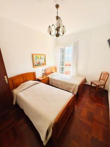 Postel nebo postele na pokoji v ubytování Casa da Rochinha