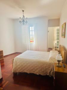 Postel nebo postele na pokoji v ubytování Casa da Rochinha + 7 fotografií