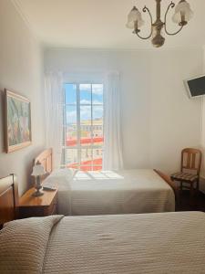 Postel nebo postele na pokoji v ubytování Casa da Rochinha