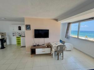 a living room with a view of the ocean at Studio with Stunning Sea View in Hammam Sousse