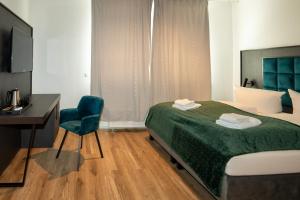 Katil atau katil-katil dalam bilik di Hotel Hamburg Nord