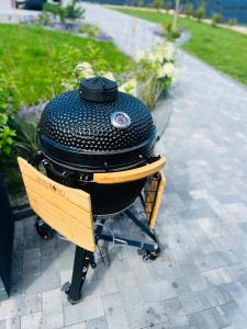 a grill sitting on top of a table at Lake House in Telšiai +14 photos