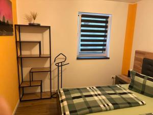 Ένα ή περισσότερα κρεβάτια σε δωμάτιο στο Bayerwaldapartment
