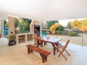 a living room with a wooden table and chairs at Crane Song Cottage-Solar Power in Himeville