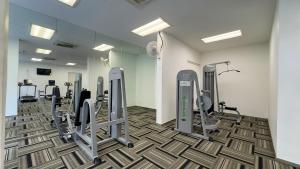 a gym with treadmills and ellipticals in a room at Danga Bay The Balcony Coast 2BR 4 Pax w Mahjong by Our Stay in Johor Bahru