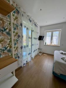 Ένα ή περισσότερα κρεβάτια σε δωμάτιο στο Casa Vacanze Imma