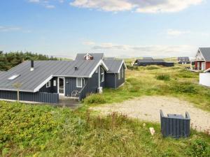 a row of houses on the beach at 10 person holiday home in Harboøre-By Traum in Harboør