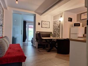 a living room with a table and a kitchen at Fewo Relax Family in Borken