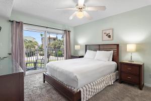 a bedroom with a bed and a large window at Maravilla 3202 in Destin +47 photos