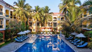 an image of a swimming pool at a resort at La Estoria, Goa - IHCL SeleQtions in Candolim