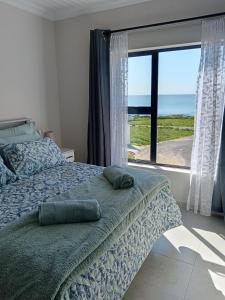 Postel nebo postele na pokoji v ubytování Russobietjie Luxury Self-catering House