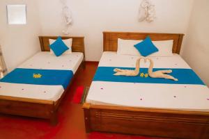 Postel nebo postele na pokoji v ubytování Udawalawe Wild Sfari Resort