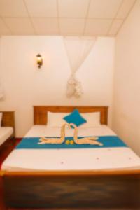 Postel nebo postele na pokoji v ubytování Udawalawe Wild Sfari Resort + 5 fotografií