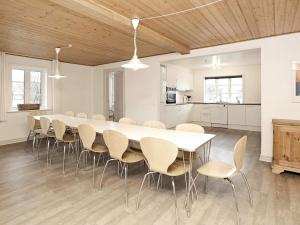 a large dining room with a white table and chairs at Seaside Escape in Ho - By Traum Ferienwohnungen in Ho +17 photos