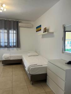 Ένα ή περισσότερα κρεβάτια σε δωμάτιο στο Marco's Appartments