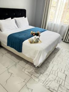 Ένα ή περισσότερα κρεβάτια σε δωμάτιο στο Lilly Sky Apartments