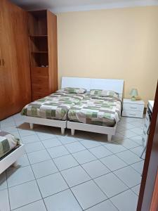 Katil atau katil-katil dalam bilik di Appartamento X Vacanze Ca' Mercati