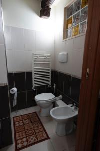 a small bathroom with a toilet and a sink at Casa Vacanze Vr Service in Potenza +15 photos