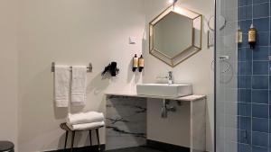 a bathroom with a sink and a mirror at Monte Belvedere Hotel by Shiadu in Lisbon +68 photos