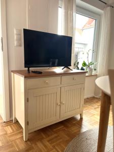 Μια τηλεόραση ή/και κέντρο ψυχαγωγίας στο Stylische Wohnung mit top Anbindung - zum Relaxen