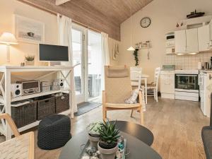 a living room with a kitchen and a dining room at 4 person holiday home in Ærøskøbing in Ærøskøbing