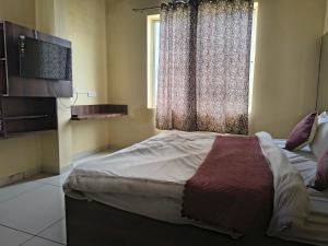 Katil atau katil-katil dalam bilik di Hotel shri Balaji