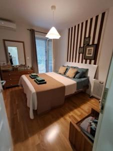a bedroom with a large bed and a mirror at La vita e bella in Prčanj +34 photos