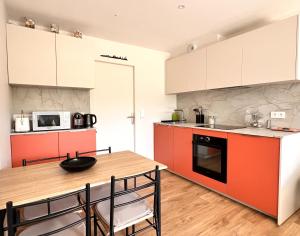 Η κουζίνα ή μικρή κουζίνα στο Harmony, appartement neuf avec piscine chauffée