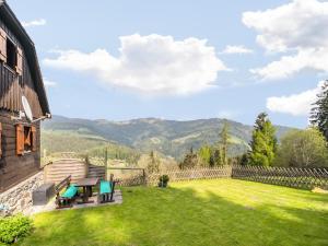 a garden with a view of the mountains at Chalet in Kalchberg near Klippitztörl Ski in Bad Sankt Leonhard im Lavanttal