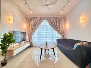 a living room with a couch and a table at D'Chill Suite【Austin Regency】Netflix in Johor Bahru