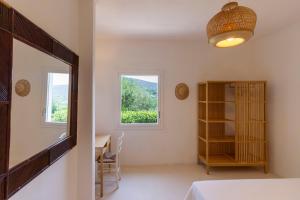 a room with a mirror and a table and a desk at Villa Tuna in Torre delle Stelle