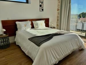 Ένα ή περισσότερα κρεβάτια σε δωμάτιο στο Paços de Douro - Chambre 4 Charme & Calme