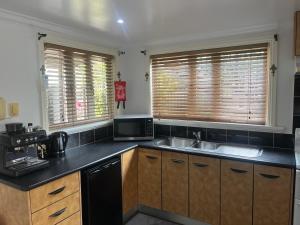 Η κουζίνα ή μικρή κουζίνα στο Cairns exclusive apartment