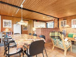 a large dining room with a table and chairs at 8 person holiday home in Svendborg in Svendborg